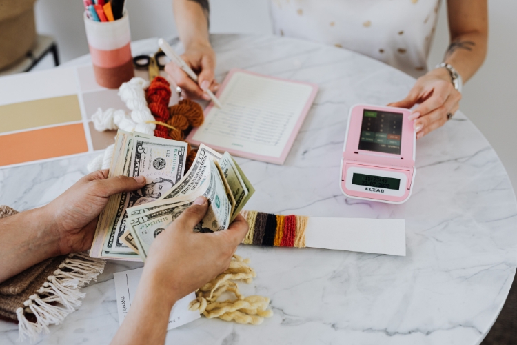 man calculating money focus