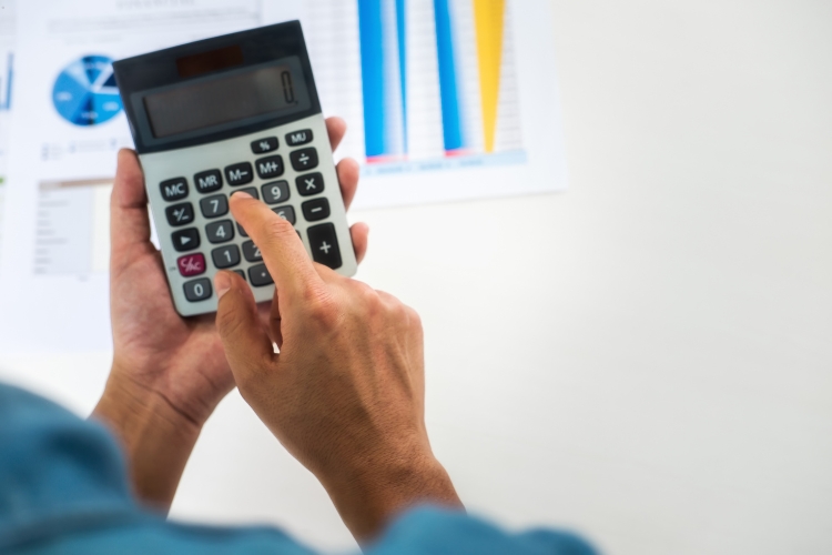 man using calculator focus 
