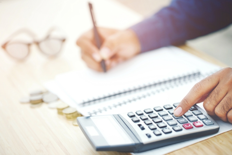 man using calculator focus