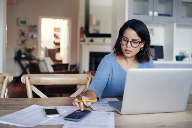 working woman using calculator