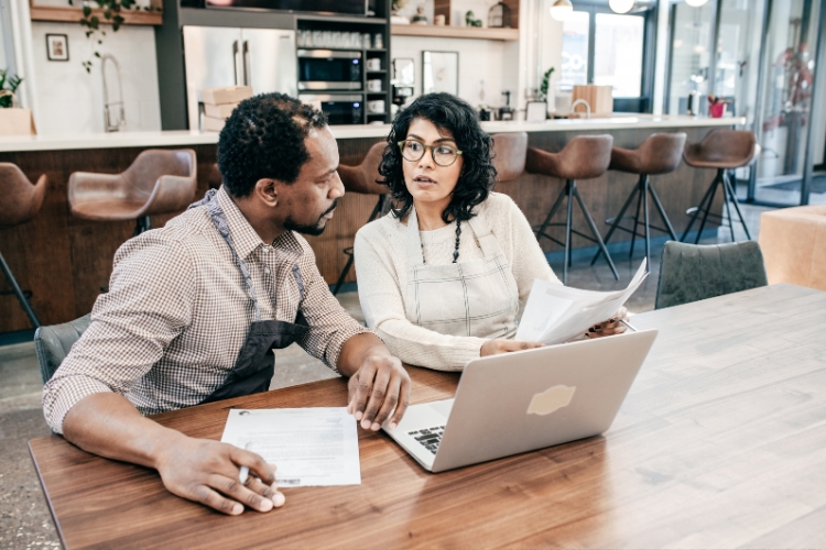 man and woman working in office