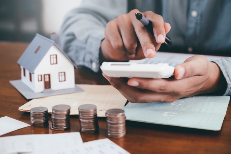 man using calculator focus