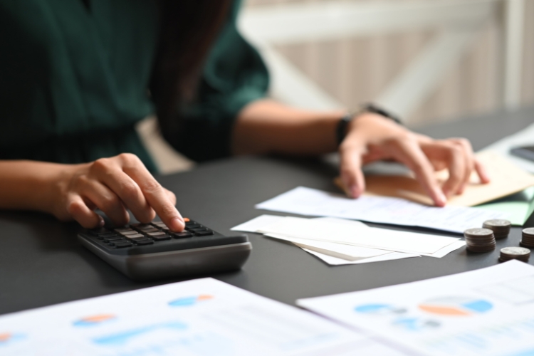 woman using calculator focus
